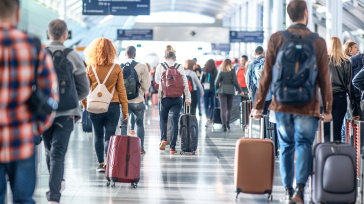 Corporate traveler at an airport for UK business flights